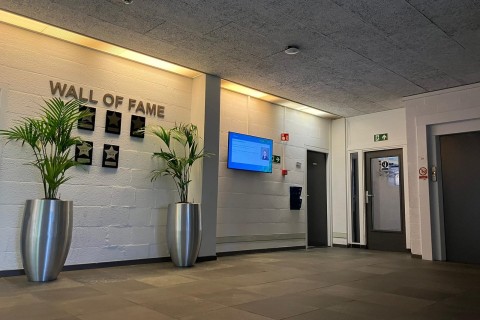 Digital signage screen near entrance